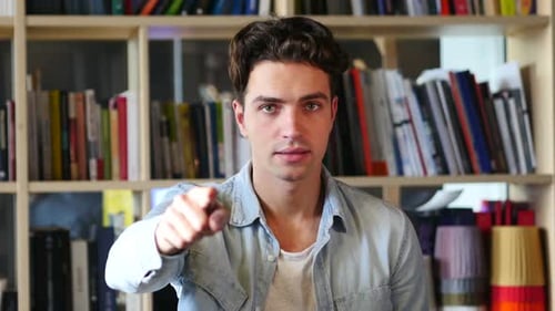 Young Adult Man Pointing Directly at the Camera