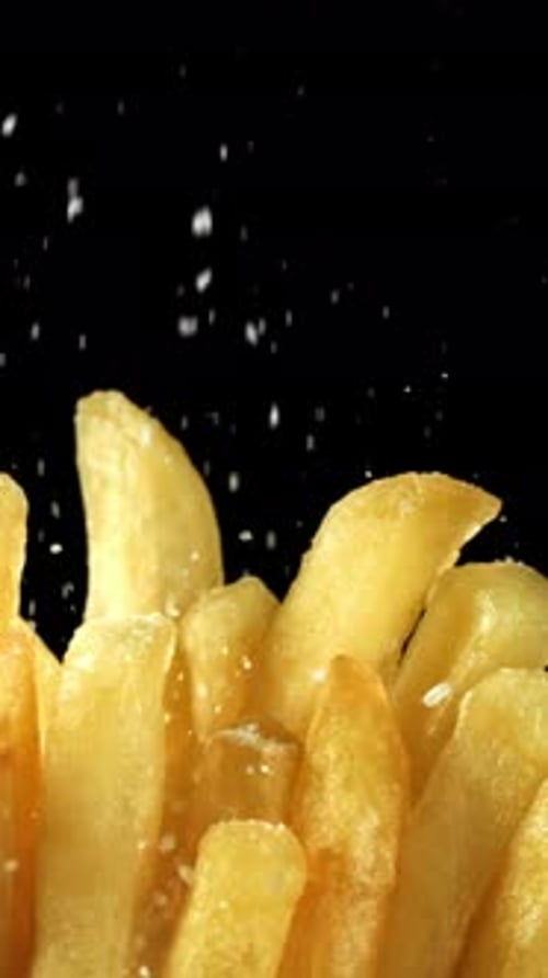 Salt Falls on the French Fries Filmed on a Highspeed Camera at 1000 Fps