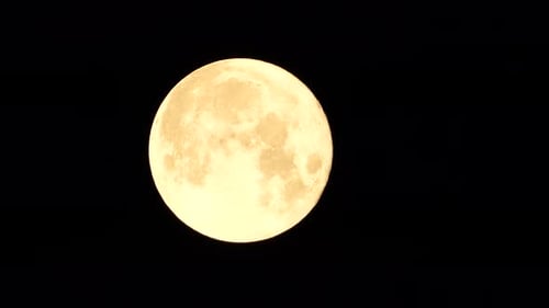 Close Up of a Glowing Full Moon in Space
