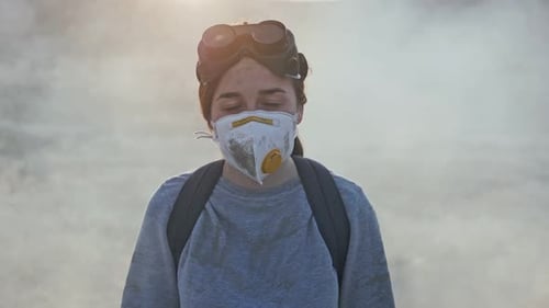 Young Adult Wearing Mask and Goggles in Wasteland