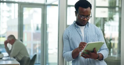 Office, typing or black man with tablet for programming, monitor system performance