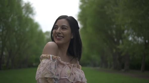 Elegant Woman Posing in Green Spring Park