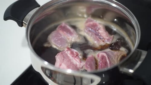 Meat Simmering in Pot with Parchment Paper