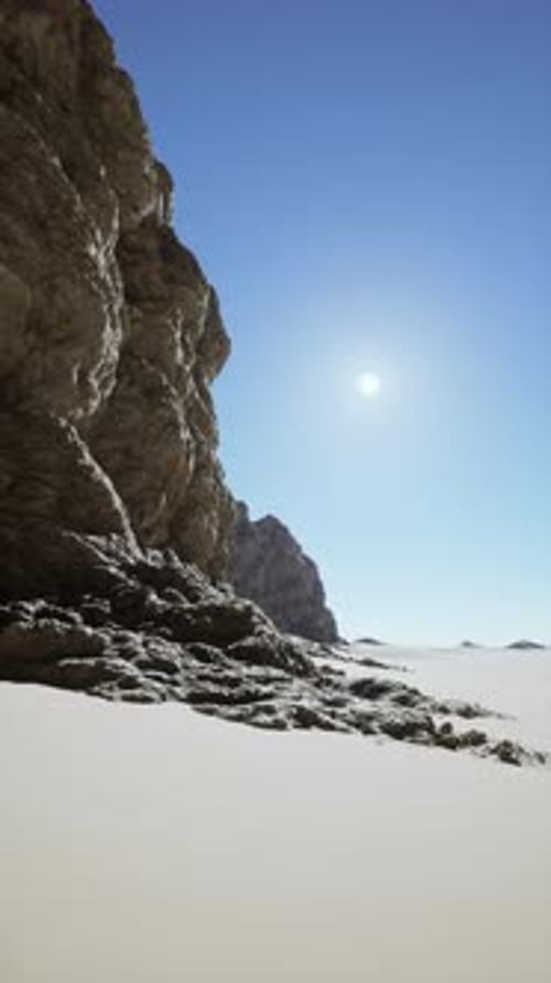 Sun Shining Over Rocky Cliff
