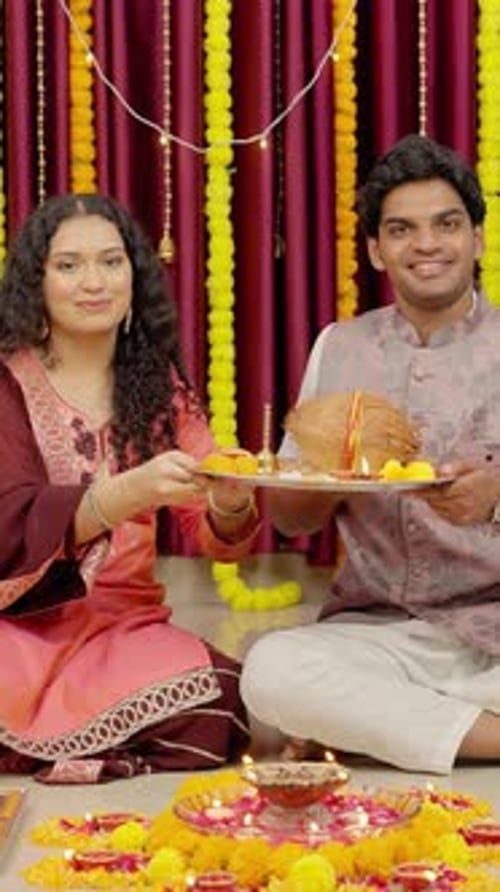 Smiling Woman and Man Hold Plates in Decorated Home
