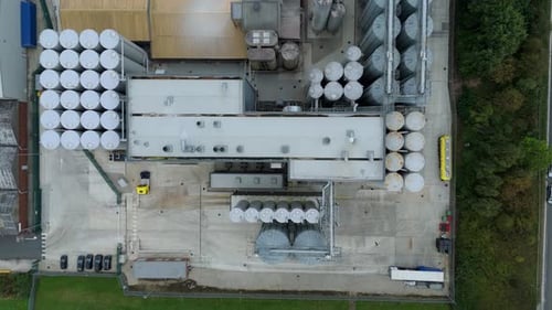 Aerial view of industrial plant with storage tanks, United Kingdom.