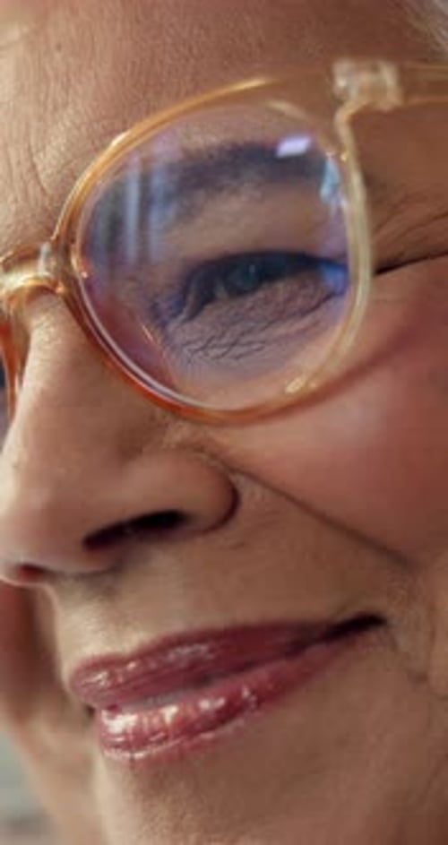 Closeup, glasses and elderly woman in office for optometry, optical or eye exam for vision