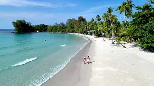 Stunning Beach Stroll on Koh Kood Island with Crystalclear Waters and Lush Palm Trees