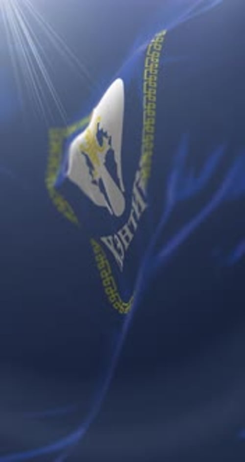 Waving Blue Fabric Background with Gold Geometric Pattern and Bird Emblem