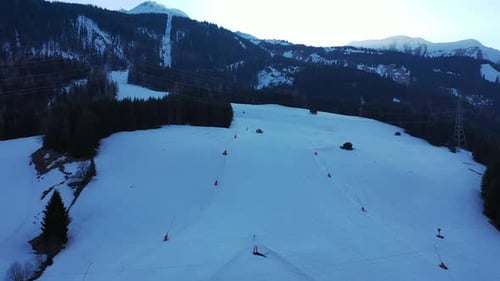 Piste Groomer (Pistenbully) plowing snow on a ski resort