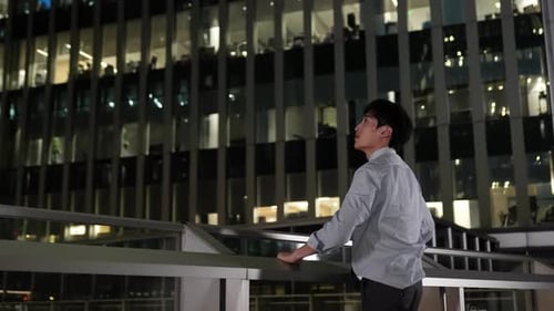 Portrait successful businessman leaning railing stand against balcony overpass view of night light c