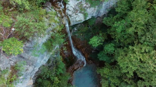Drone Rising Over Red Rock Waterfall Mount Olympus Greece