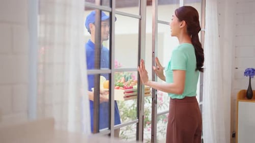 Woman Receives Vegetable Delivery at Her Home