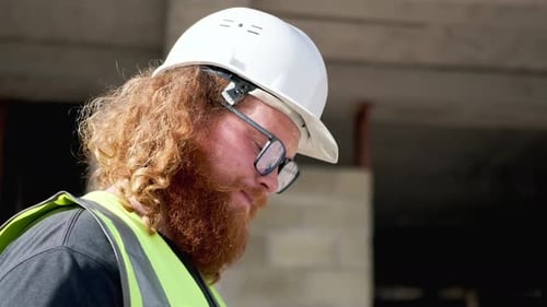 Man engineer contractor problem solving with digital tablet at construction site