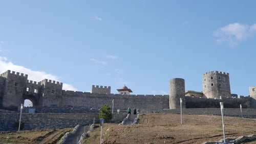 Ancient stone fortress with towers. Action. Fabulous view of stone fortress with towers