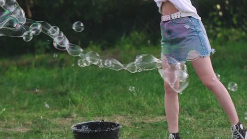 Girl Inflates Big Soap Bubbles Outdoors Leisure