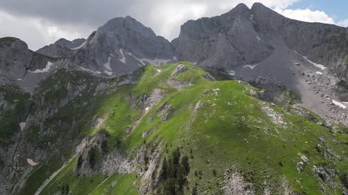 Beautiful epic rocks with scatterings of stones and coniferous trees. Mountains Komovi. Montenegro.