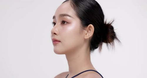 Slow motion of beautiful young Asian girl with k-beauty make up style.