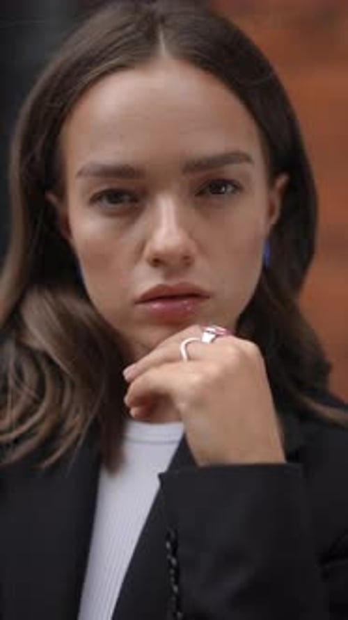 Woman Posing with Colorful Jewelry and Chic Style