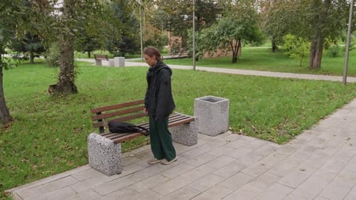 Girl in Park Young Woman Sitting Alone Outdoors Female Pedestrian Pausing in City Park Autumn Woman