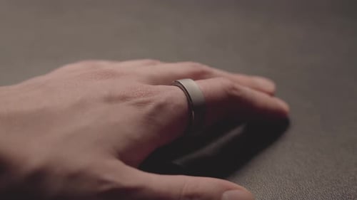 Hand Wearing Silver Smart Ring Close Up