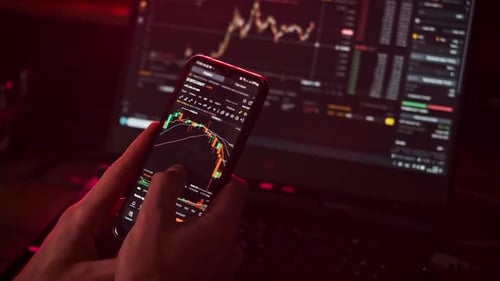 Crypto Businessman Working with Stock Market Data Graph on a Smartphone