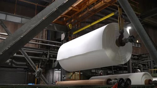 Cellulose paper roll in industrial factory production line inside manufacturing plant during
