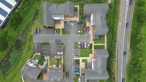 Aerial View of Suburban Homes and Cars