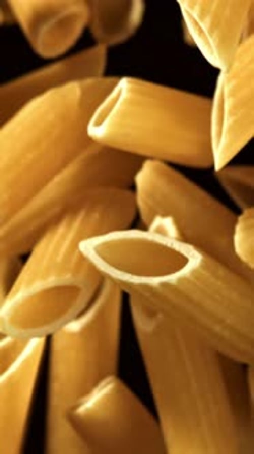Super Slow Motion Flying Dry Penne Pasta Filmed on a Highspeed Camera at 1000 Fps
