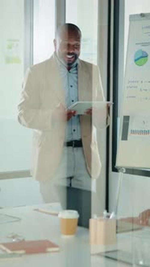 Tablet, whiteboard and man with graph in meeting for market analysis, profit growth and budget