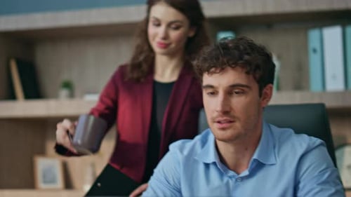 Cheerful Colleague Bringing Coffee to Man Corporate Leader at Workplace Close Up