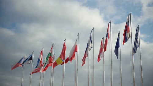 National Flags Waving in the Wind on Cloudy Day