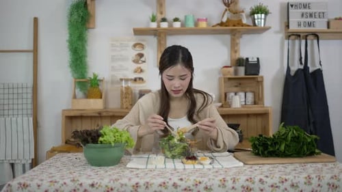 Woman Making Salad in Bright Kitchen