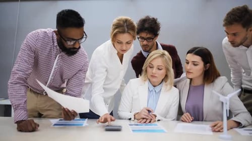 Green Renewable Energy, Teamwork, Corporate And People Concept - Business Team With Papers And Wi...