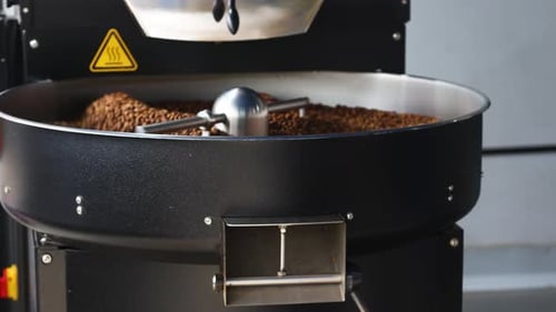 Coffee Beans Roasting in a Stirring Machine
