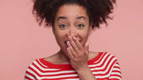 Excited Woman Reacting to Surprising Good News on Pink
