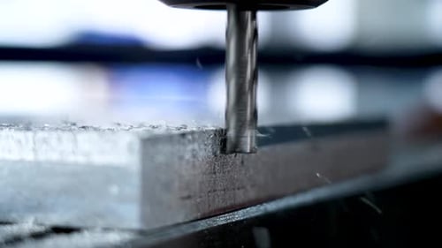 The head of the metal cutting machine at the moment of cutting the metal and removing the impurities
