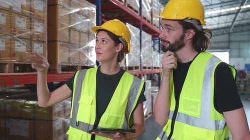 Both of employees in an auto parts warehouse,