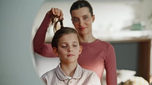 Mom Braiding Daughter Mirror Reflection Closeup Family Enjoying Beauty Routine