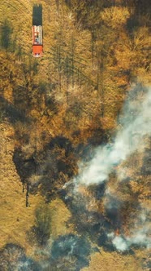 Aerial View of Wildfire Burning Through Rural Landscape
