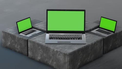 3D Laptops with Green Screens on Concrete Blocks for Product Presentation
