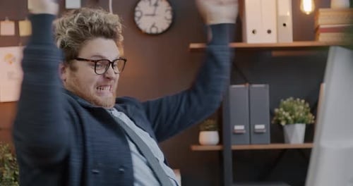 Loop of Overjoyed Businessman Looking at Smart Phone Screen Laughing Screaming Expressing Happiness