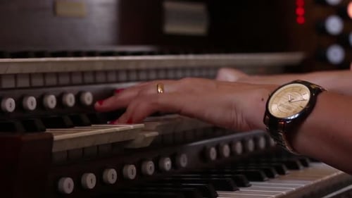 Woman Plays Beautiful Music on Church Organ