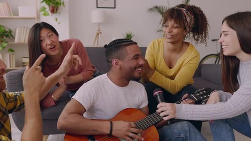 Friends Singing Together With Acoustic Guitar