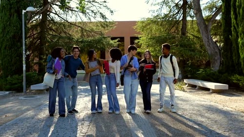 Diverse Group of University Students Walking Together on Campus