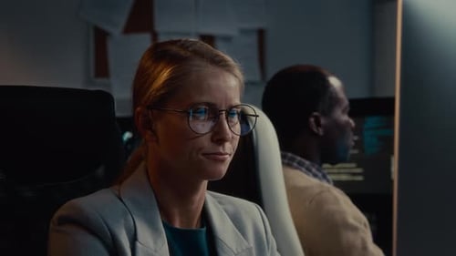 Caucasian Female Data Protection Specialist Working on Computer in Office