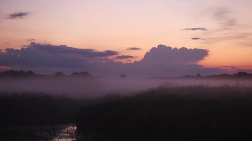 Timelapse of Fog Flowing Over a River Valley Beautiful Misty Morning