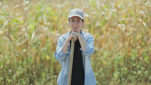 Rural Woman Enjoying the Bright Day in the Field Surrounded By Corn
