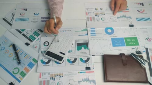 Business people reviewing charts and data