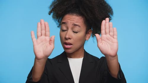 Young Woman Gesturing Stop with Hands, Concerned Look